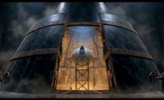 A large, metallic rocket sits inside an open, industrial structure, bathed in dramatic lighting and surrounded by mist and shadows, creating a sense of anticipation and mystery.